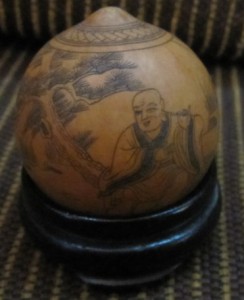 A front on view of a Chinese gourd depicting the Chinese zodiac