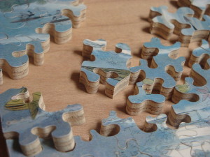 jigsaw pieces spread out on a table