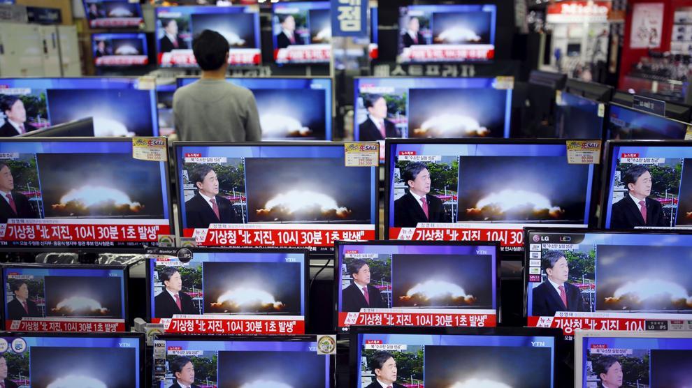 朝鲜宣称成功引爆氢弹 shop with multiple TVs broadcasting the news of north korea's h-bomb detonation