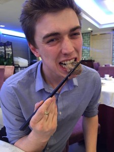 sean eating duck's head in china