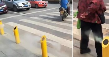 湖北马路上装喷水器 提醒人们不要闯红灯 water spray device at crossing in hubei