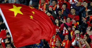 3 Things You Might Not Realise About China at This World Cup Chinese fans celebrate a goal with the national flag