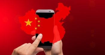 到2017年,中国已有7.72亿网民 hand touching phone with china symbol