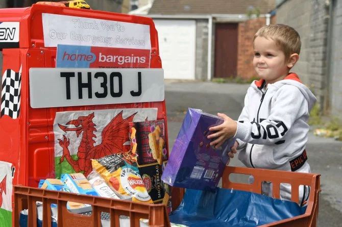 Young Boy Delivers Food in Toy Truck in UK
