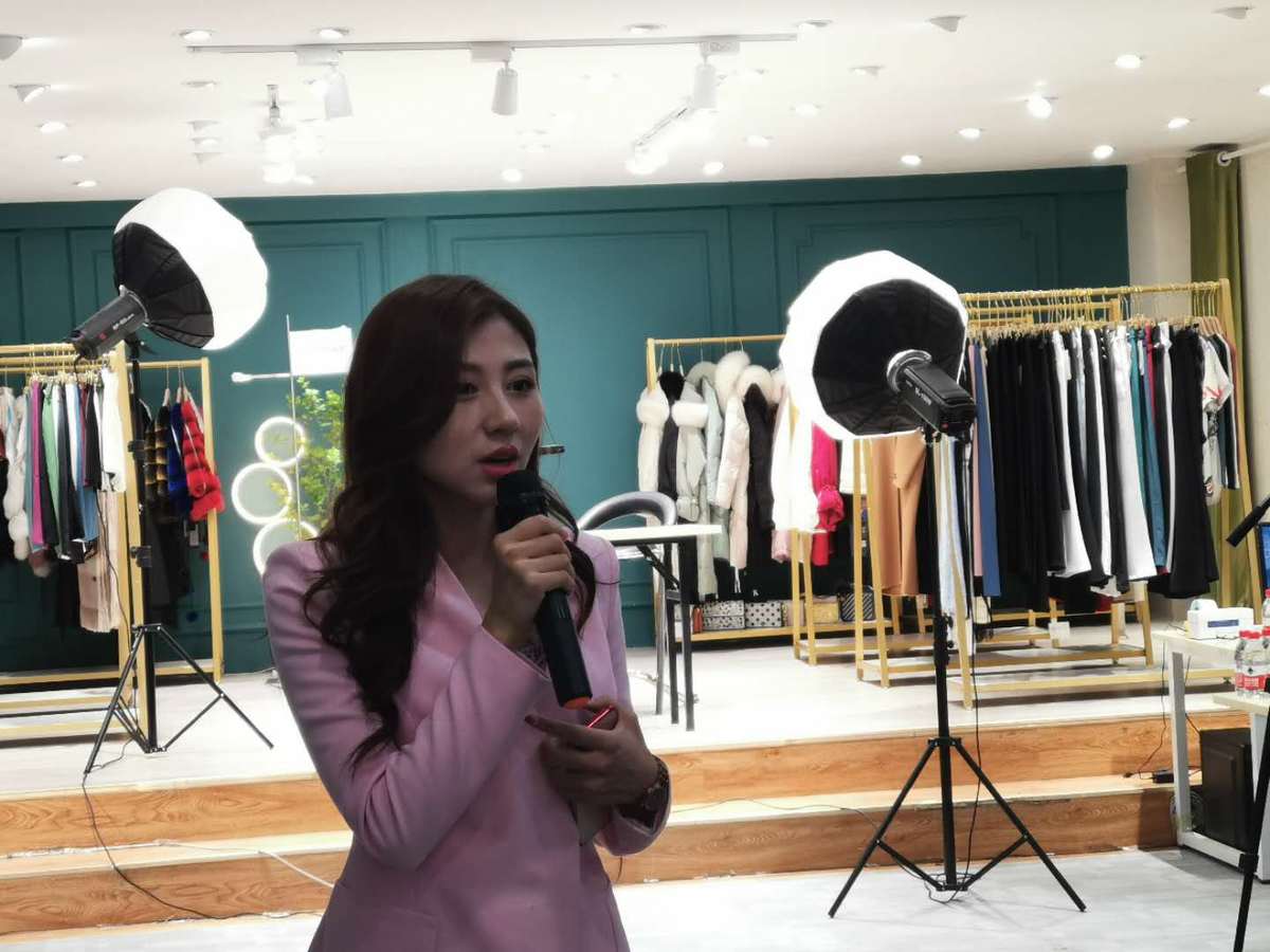 girl introducing clothes during livestream in china