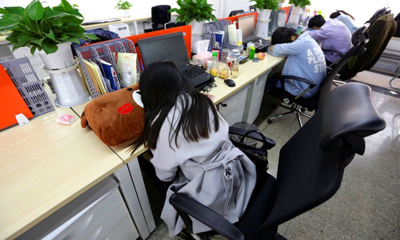 tech workers sleeping at desks in china