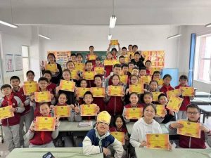 Teacher Presents Special Gift to Graduation Students