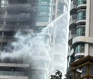 Man Dubbed "Flying Hero" for Helping Fight Fire in Guangdong