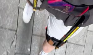 US Vlogger Rents Exoskeleton for Park Walk in China