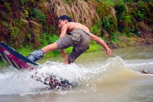 New Extreme Sport Sees Boarders Surf Flooded Rice Paddies